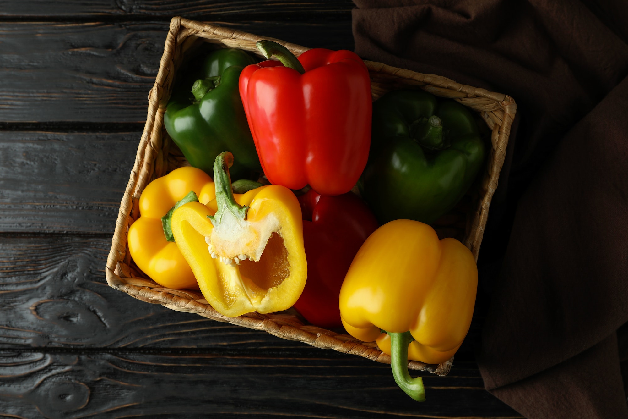 Concept of tasty food with bell pepper on wooden background