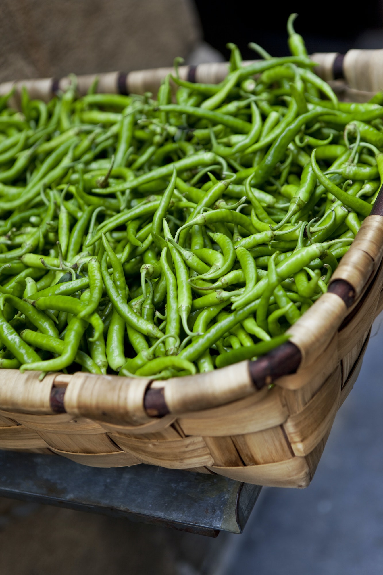 Green peppers in a wicker basket